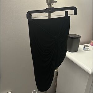 Black asymmetrical skirt with knot